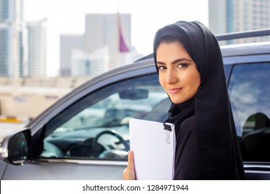 Arab Saudi women student driving her car