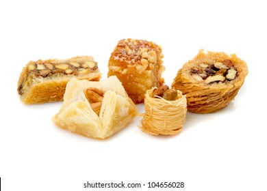 Arab Sweets Isolated On White Background, Set Of Baklava And Other Arab Sweets. Assorted Arabian, Turkish And Egyptian Pastry. Arabic Confectionery Close-up. Concept Of Middle East Dessert Food.