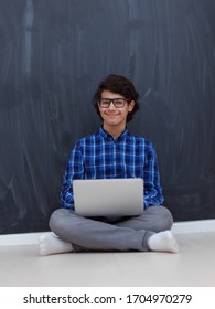 Arab Teenager Using Laptop To Work On Homework And Watch Online Education While Staying At Home Cause Coronavirus Pandemic Quarantine