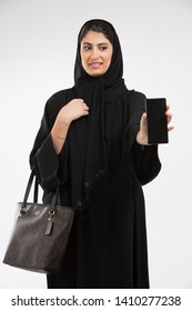 Arab Woman Holding A Mobile Phone.