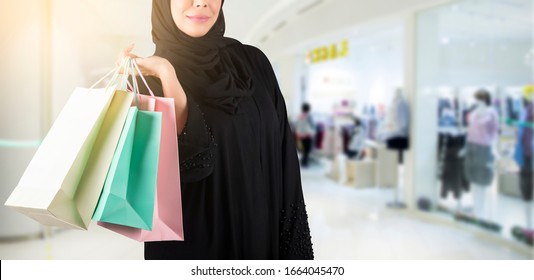 Arab Woman Holding Shopping Bags 