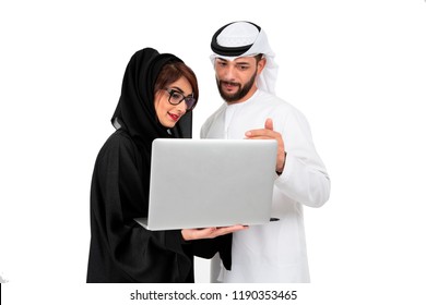 Arab woman and man working together as a team,using laptop and talking about project.