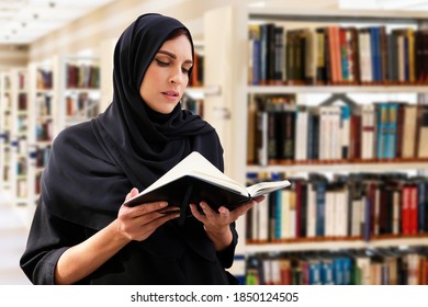 Arab Woman In Middle East Reading Book While At Library Wearing Hijab Abaya For Arabic Women