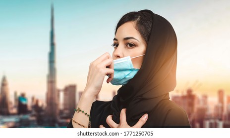 Arab Woman with protective face mask off and breathing fresh air. Concept of taking off the mask. coronavirus over concept.