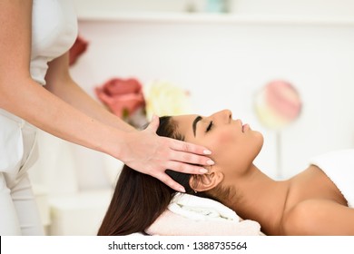 Arab Woman Receiving Head Massage In Spa Wellness Center. Beauty And Aesthetic Concepts.