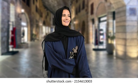 Arab Woman At Shopping Mall,  Smiling Wearing Emirati Arabic Dress Called Abaya. Happy Middle Eastern Lady