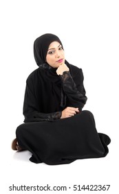 Arab Woman Sitting On The Floor Isolated On White Background