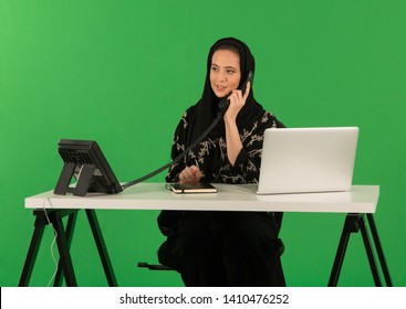 Arab Woman Talking On Telephone In Office.