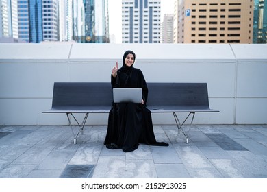 Arab Woman Working Happy With Laptop Sitting Outdoor. Saudi Arabian Muslim Businesswoman Happy Thumbs Up