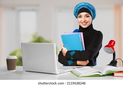 Arab At Work. Emirati Woman Using Computer Tablet Typing. Girl In Abaya And Hijab