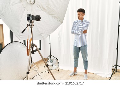 Arab Young Man Posing As Model At Photography Studio Looking Stressed And Nervous With Hands On Mouth Biting Nails. Anxiety Problem. 