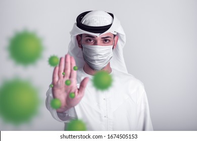 Arab young man stop hand gesture, wearing medical mask protect himself from coronavirus, Arab medical and health concept.
