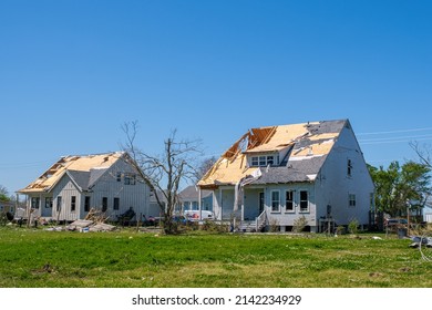 Arabi, LA, USA - MARCH 26, 2022: Two Houses With Severe Roof Damage And A Stripped Tree From March 22, 2022 Tornado