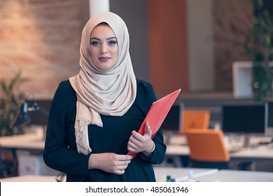 Arabian business woman holding a folder 