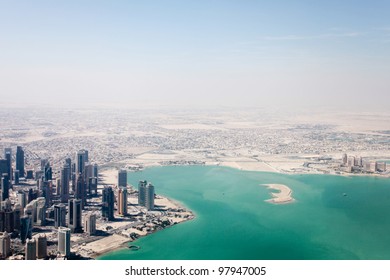 Arabian City With Big Buildings And Ocean From Skyview