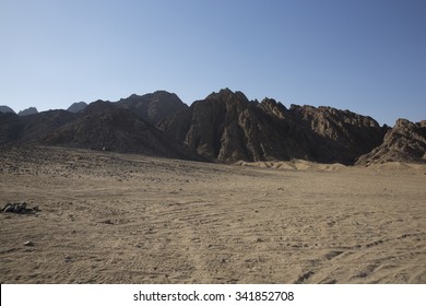 Arabian Desert and blue sky and high mountain in middle East 