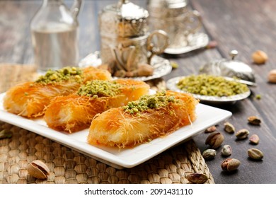 Arabian Dessert rolls - Kunafa Cream with pistachio nuts on top ( mabromeh )
