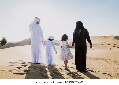 Arabian Family Spending A Weekend In The Desert, In Dubai