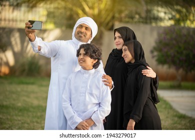 Arabian Family Taking Selfie With Phone  Outdoors 