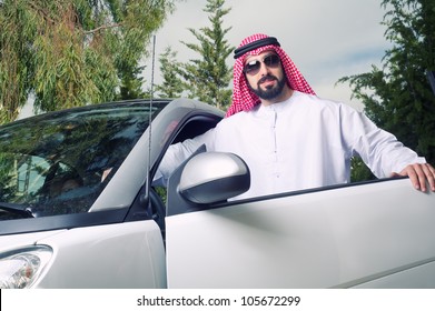 Arabian Guy Posing Against His Car At Home