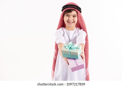 Arabian Happy Boy In Keffiyeh Presents Gift Boxes. Isolated On White Background. Studio Portrait.