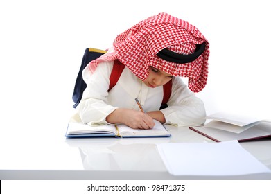 Arabian kid writing on the table