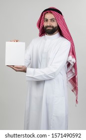 Arabian Man Holding A White Box 