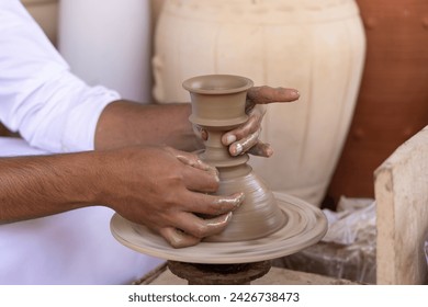 An Arabian Man Makes Clay Pots - Powered by Shutterstock