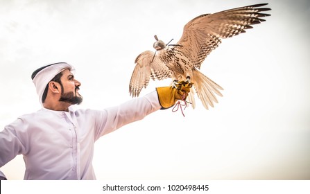 Arabian man walking  in the desert at sunrise - Powered by Shutterstock