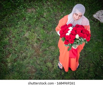 Arabian Woman Holding Flower Bouquet