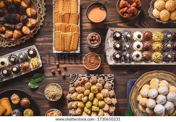 Arabic Cuisine; Cookies for celebration of El-Fitr\
Islamic Feast.(The Feast that comes after Ramadan). Varieties of\
Eid Al-Fitr sweets(kahk,biscuits, petit four). Top view with close\
up.