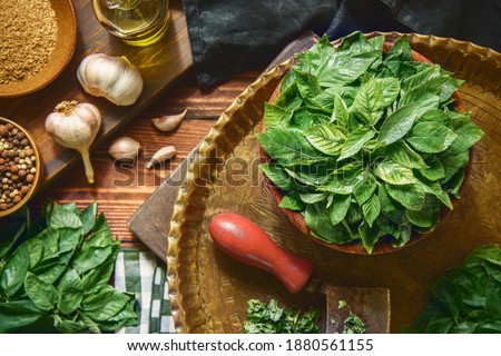 Arabic Cuisine; Egyptian organic jute leaves, Jew's mallow or (Molokhia). Those leaves are nutrient leafy greens full of phytonutrients that support heart health and immunity. Top view with close up.