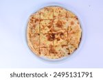 Arabic Cuisine; Feteer meshaltet - Feteer (Egyptian Pie), It consists of many thin layers of dough and ghee - with vegetables, meat, cheese and other ingredients .