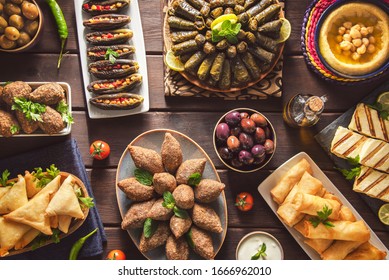 Arabic Cuisine;  Middle Eastern traditional dishes and assorted mezze or meze. Vine leaves, kibbeh, spring rolls, sambusak, kibbeh nayyeh, makdous, haloumi cheese, olives,hummus and yogurt salad.