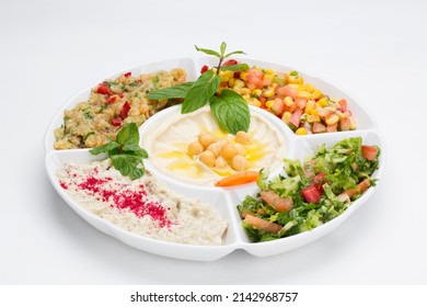 Arabic Cuisine ;Middle Eastern traditional assorted meze. Vine leaves, kibbeh,chicken fatteh, spring rolls, sambusak, kibbeh nayyeh, makdous, haloumi, olives, eggplant fatteh and salads.