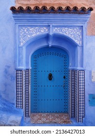 Arabic eave over door in african Chefchaouen town in Morocco in 2019 warm sunny spring day on April - vertical - Shutterstock ID 2136427013