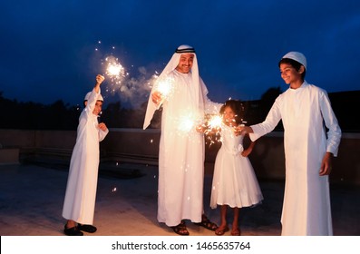 An arabic family  enjoying the sparkle of the festivity during festival celebration.