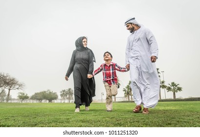 Arabic Family Playing With Child