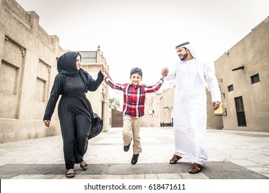 Arabic family playing with child