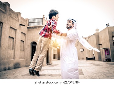 Arabic family playing with child