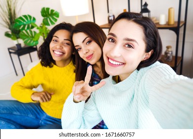 Arabic Girl Recording Selfie Video With Multiracial Friends At Home