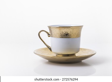 An Arabic Golden Coffee Cup With Saucer.