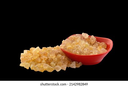 Arabic gum or edible gum natural manna resin crystal, mana, Senegal acacia on black background. Nutritional edible aromatic health food, New Delhi India.
