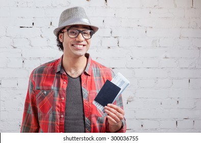 Arabic Hipster Man Holding Passport And Tickets