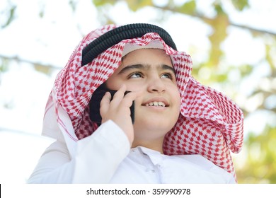 Arabic Kid Talking On Phone