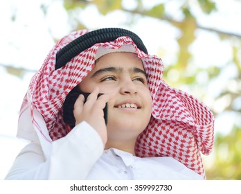 Arabic Kid Talking On Phone