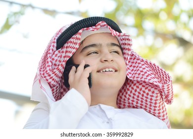 Arabic Kid Talking On Phone