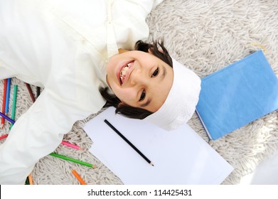 Arabic little boy doing homework at home - Powered by Shutterstock