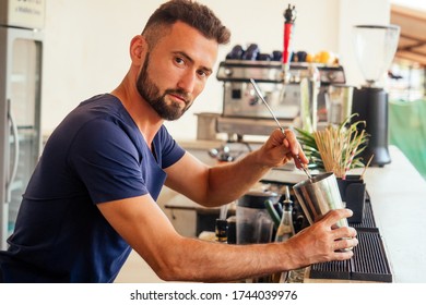 arabic man bartender making fresh coctail for lady - Shutterstock ID 1744039976