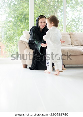 Arabic mother with baby at home